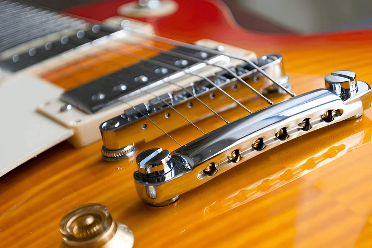 Gibson Ripper Bridge Wraparound Bridge vs Tune-o-matic: Guide to Gibson Bridges – Guyker